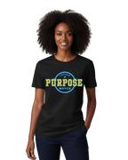 Woman wearing a black t-shirt with 'PURPOSE MOVES' text on a powder blue and yellow background